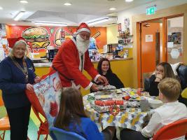 Santa bringing the Minehead Young Carers some Christmas Presents
